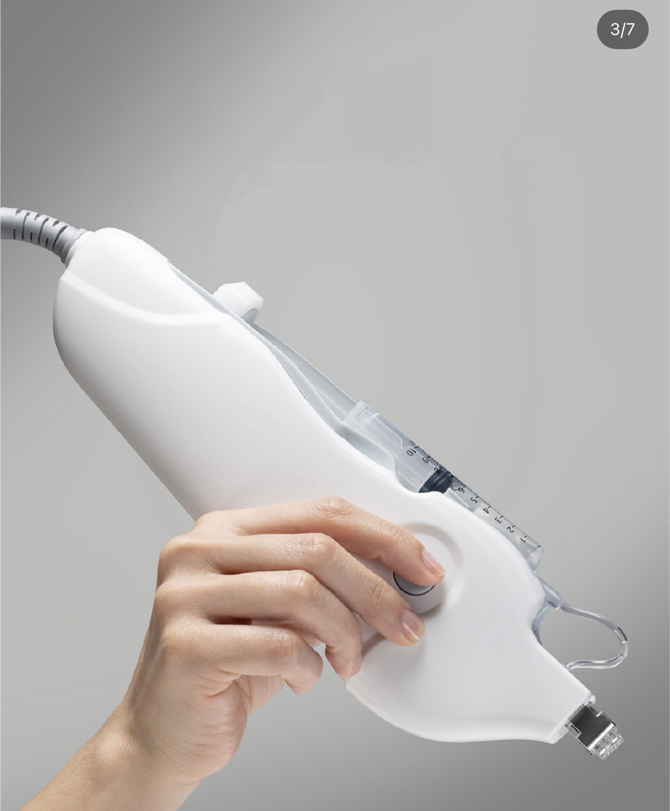 Close-up of the MESONUEVO EPM professional handpiece with syringe and micro-array interface